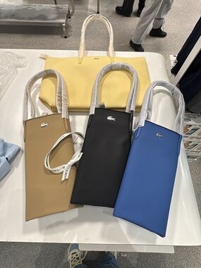 Lacoste Yellow Tote with Tan, Black and Blue Crossbody Bags